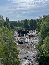 Sailboat in the harbor at sunset